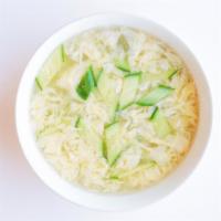 Egg Drop Soup · Light, velvety soup w/ a swirl of fresh egg and cucumbers. Serves 2.