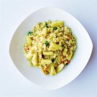 Pineapple Fried Rice · Fresh pineapples, eggs, peas, and carrots tossed in a wok with a pinch of curry powder for a...