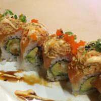 Chuck Norris · Shrimp tempura, avocado inside, w/ salmon, spicy crab on top with fish eggs and green onion