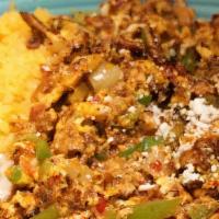 Huevos Con Chorizo · Two eggs scrambled with Mexican sausage mixed tomatoes, onion, bell peppers topped with dry ...