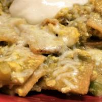 Chilaquiles Rojos or Verdes · Two large eggs scrambled with tortillas mixed with onions, bell pepper & tomatoes your choic...
