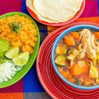 Caldo Tlalpeno · Hot. Spicy chicken soup and vegetables with side of rice and avocado.