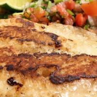 Filete a La Plancha · Grilled fish fillet - served with rice, choice of pinto, black or refried beans, salad and t...