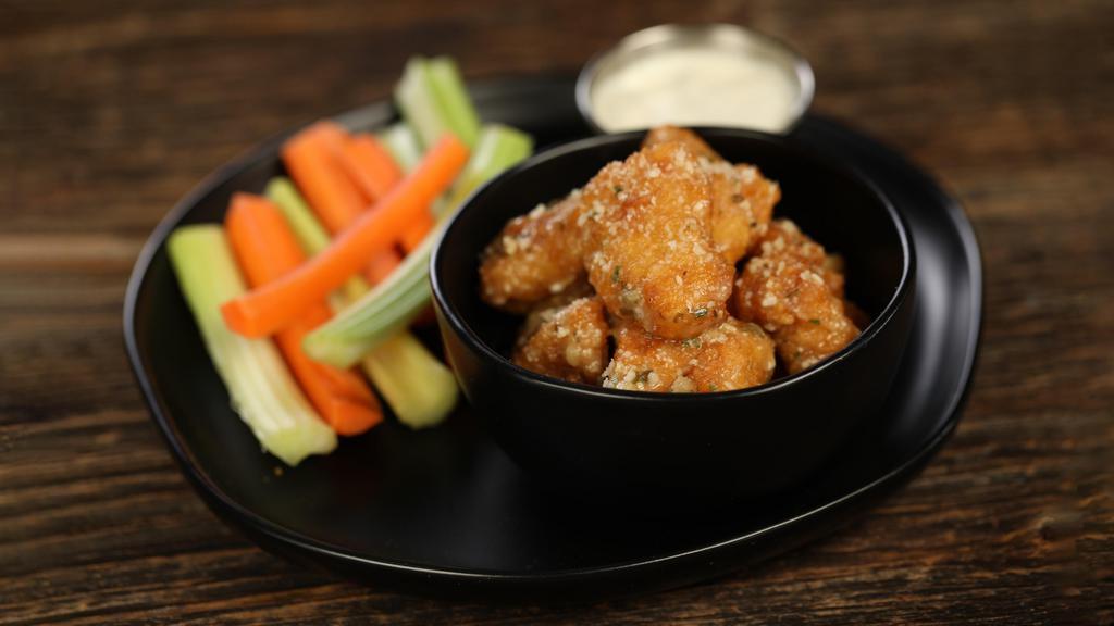 Boneless Garlic Parmesan · 8 boneless wings tossed in garlic Parmesan (mild heat), served with carrots & celery and a dipping sauce of your choice.