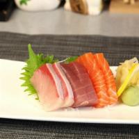 F. Sashimi (6 Pieces) · Tuna, salmon, hamachi.