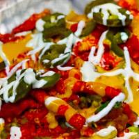 Flamming steak fries · French fries tosssed in flamming hot Cheetos topped with more Cheetos steak,sour cream,jalap...
