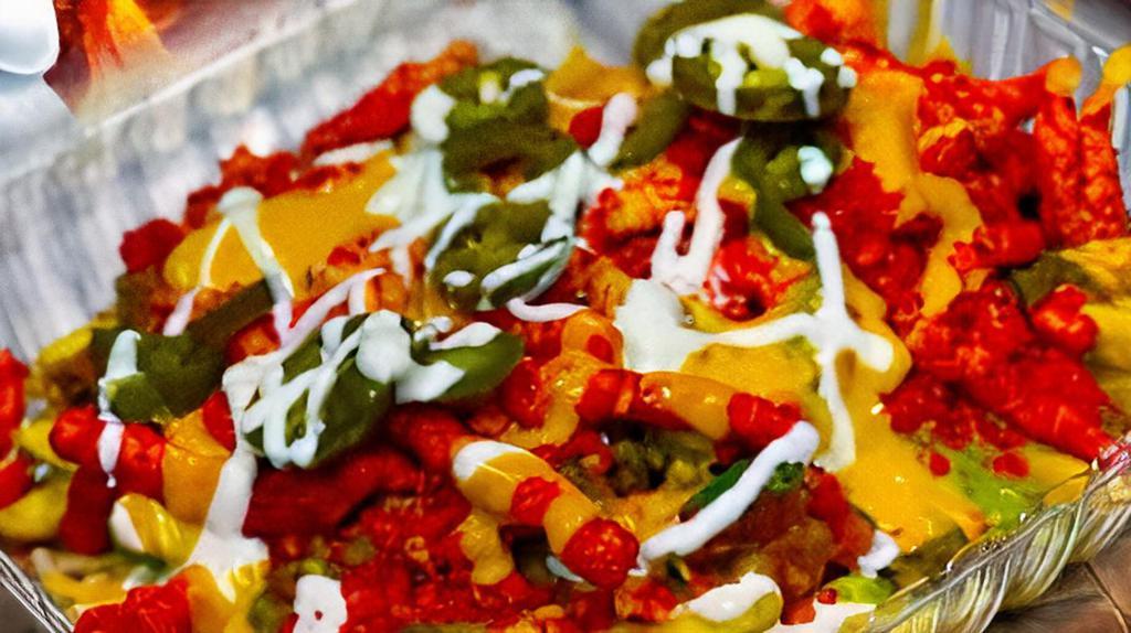 Flamming steak fries · French fries tosssed in flamming hot Cheetos topped with more Cheetos steak,sour cream,jalapeños,nacho cheese,and avocado salsa