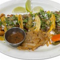 Tacos · All tacos are topped with cilantro and onions with a side of red/green salsa, grilled onions...