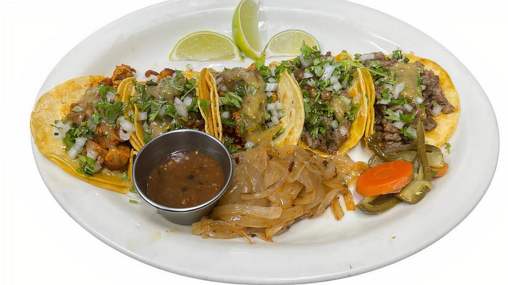 Tacos · All tacos are topped with cilantro and onions with a side of red/green salsa, grilled onions and dilled jalapeno carrot mix.