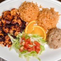 Camarones ala diabla · Shrimp sautéed in our house chipotle sauce served with rice beans and tortillas