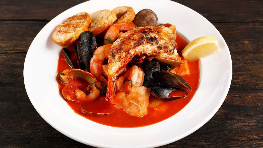 Lobster & Seafood · Stew clams, mussels, prawns, calamari, and fish with tomato brodo.