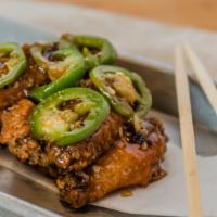 Blurr Chicken Wings · Crispy chicken wings with house made habanero hot sauce glaze and tamarind. (wheat allergies).
