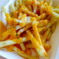 Buffalo Fries · Golden-crispy fries salted to perfection, topped with buffalo sauce and ranch dressing.