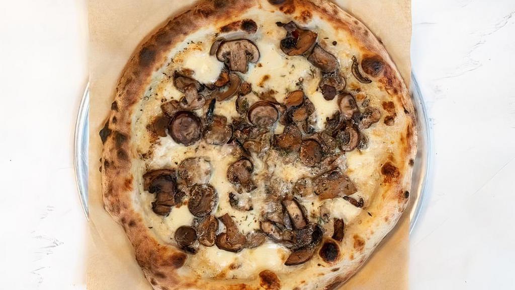 MUSHROOM PIZZA · Ricotta cheese, fresh mozzarella, Crimini and Portobello mushrooms, thyme and black pepper.