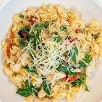 FUSILLI W/CHICKEN · Fusilli pasta, chicken, broccoli rabe, sun dried tomatoes, fresh basil and parmesan cheese.