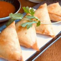 Tea House Samusa · Spring  rolls pastry filled with potato, onion, and Burmese spices.  Deep fried and served w...