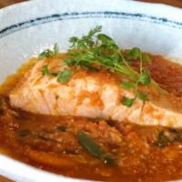 Salmon Curry · Salmon cooked with tomato, onion, garlic, ginger, red chili paste, tamarind puree, and basil.