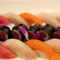 304. Sushi Deluxe · Chef's choice four pieces nigiri, four pieces sashimi, rainbow roll.