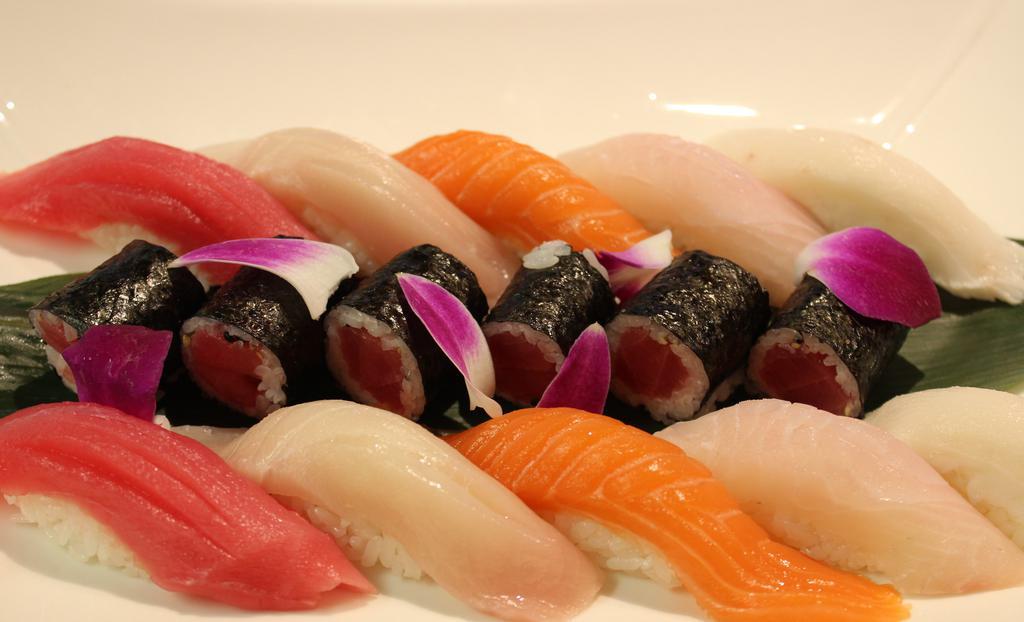 304. Sushi Deluxe · Chef's choice four pieces nigiri, four pieces sashimi, rainbow roll.