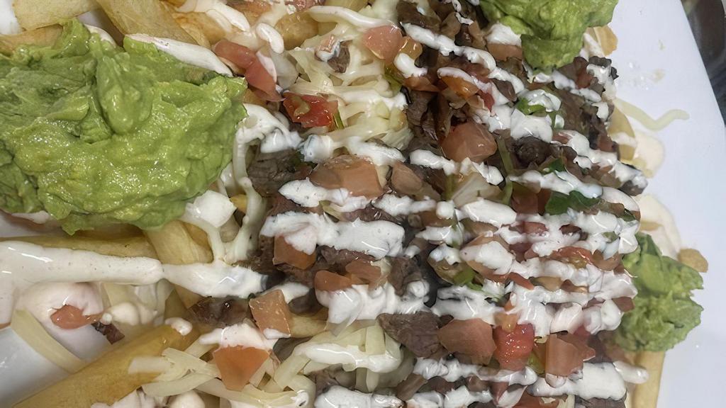Cali Fries · Choice of meat over fries, melted Oaxaca or jack cheese, pico de gallo, lettuce, tomatillo salsa and sour cream.