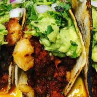 Tacos Mamalon · Two big tacos in a combination with shrimp, steak, chorizo, cheese, guacamole, onions & cila...