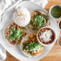 Street Tacos · Street tacos, choice of meat, onions, cilantro & salsa.