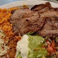 Asada Platter · Steak (certified angus beef), caramelized onions, salsa ranchera. Served with rice, beans, a...