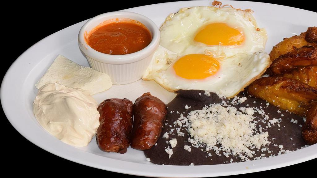 Desayuno Chapin  · Traditional breakfast of Guatemala, fried or scrambled eggs, cream, fresh cheese, bananas, chorizo, beans and tortillas.