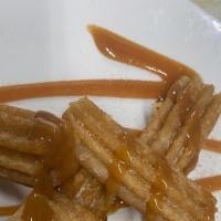 Churros  · House made with dulce de leche.
