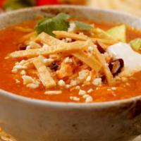 Tortilla Soup · Base with fried tortilla chip, avocado slices, sour cream and cheese.