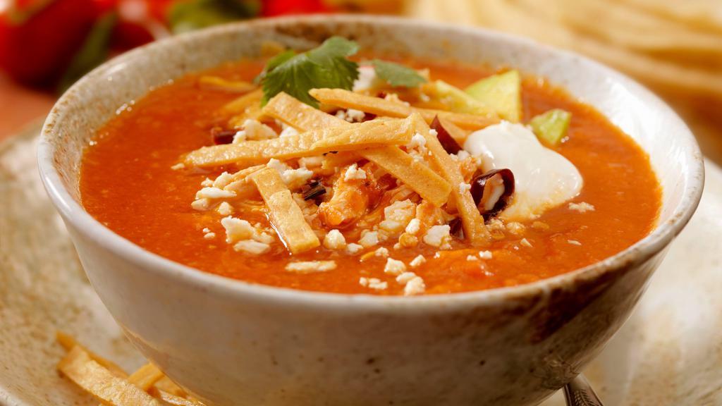 Tortilla Soup · Base with fried tortilla chip, avocado slices, sour cream and cheese.