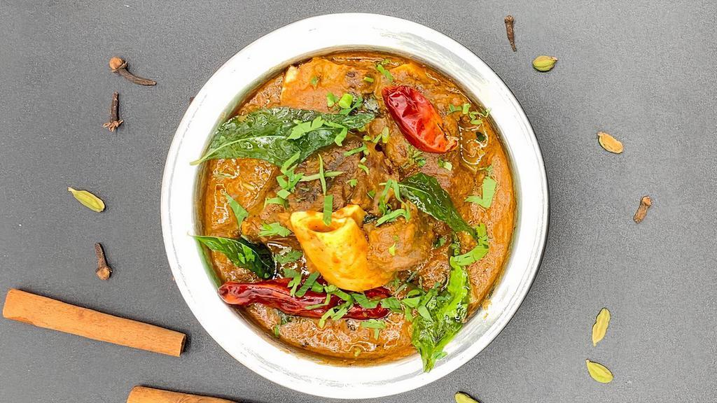 Goat Curry · Succulent cut of bone in Goat pieces cooked in the traditional rich curry sauce.