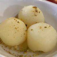 Rasgulla · ball-shaped dumplings of chhena (cheese curds) cooked in light sugar syrup.