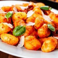 Gnocchi · Potato pasta with flour with choice of  of house made sauce.
