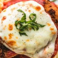 Chicken Parmesan · Breaded Chicken breast with egg wash, Parmesan and Mozzarella cheese and fresh house made Ma...