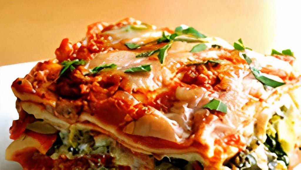 Vegetarian Lasagna · Vegetarian. Spinach, Mushroom, Onion, Bell Peppers, Mozzarella and  Parmesan  and Ricotta cheese and Marinara sauce.. Served with house salad and Garlic bread or toast. Garnished with Parsley,  Parmesan Cheese, Peppercini
