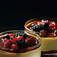 Creme Brulee e Frutti di Bosco · A layer of raspberry sauce topped with a creamy custard and decorated with mixed berries coa...