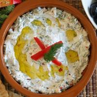 Spicy Labneh · Stained yogurt, spicy, garnished with mint flakes, topped off with fresh oil.