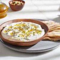 Labneh · An all-time favorite! Stained yogurt, garnished with mint flakes, topped off with fresh oil.