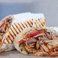 Chicken Shawarma Wrap · Chicken sandwich wrapped in lavash bread, garlic sauce and pickles.