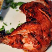 Tandoori Leg Quarter( 2 pcs) · Two chicken leg quarters  marinated in yogurt and mild spices and grilled in clay oven.
Serv...