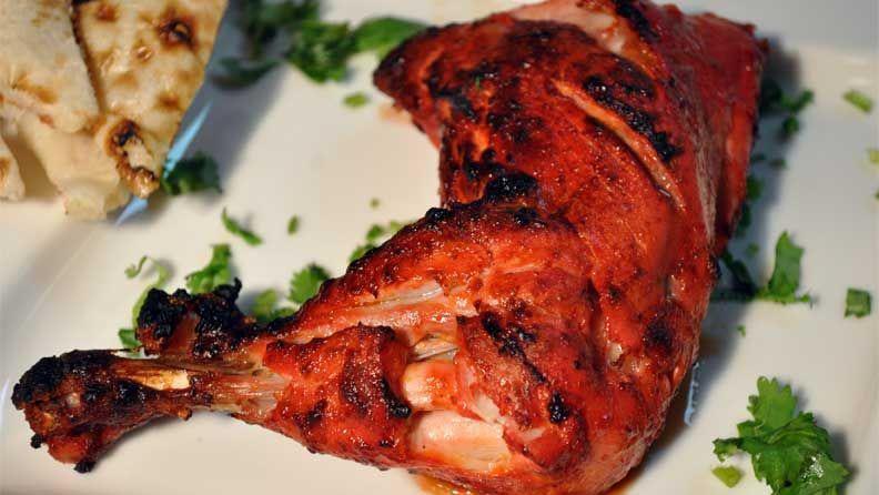 Tandoori Leg Quarter( 2 pcs) · Two chicken leg quarters  marinated in yogurt and mild spices and grilled in clay oven.
Served with Salad