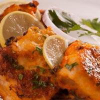 Lahori fish tikka · Fish fillet marinated in special lahori masala and cooked in clay oven.