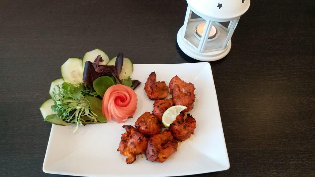 Fish Tikka · Fish fillet marinated and cooked in clay oven.