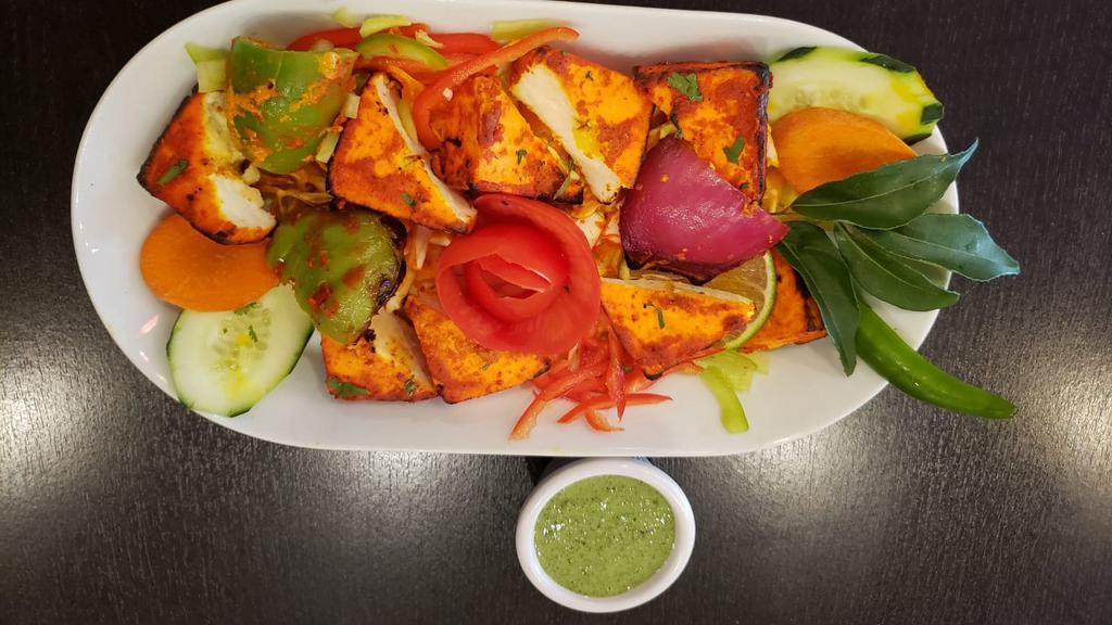 Paneer Tikka Kabab · Paneer cubes & Peppers marinated in special yogurt sauce and mild spices and grilled in clay oven.