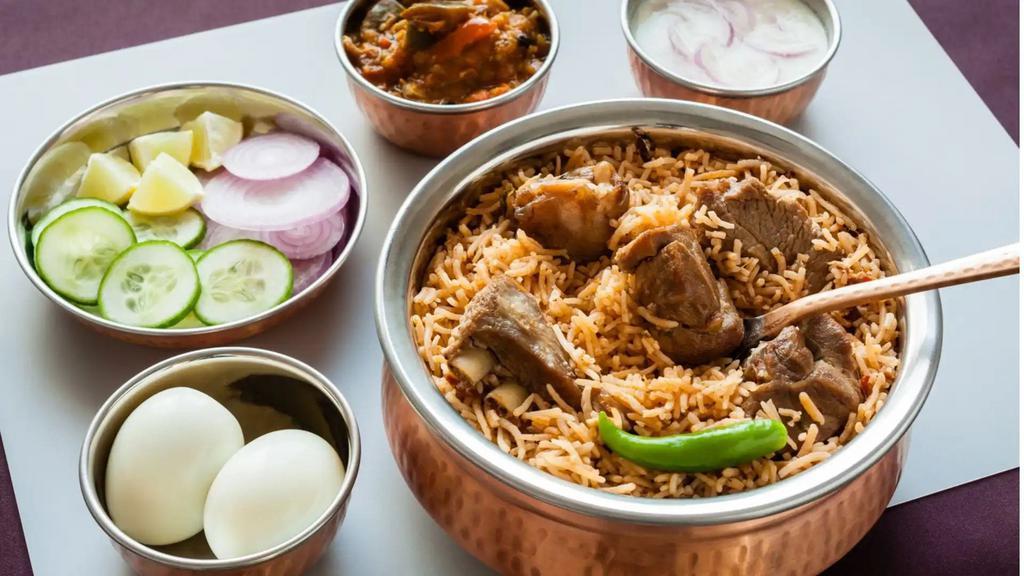 Hyderabadi Mutton Dum Biryani · Goat marinated with herbs and special spices, cooked in low heat with long grain basmati rice.