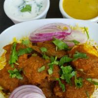 Vijayawada Mutton Biryani · goat cubes marinated with herbs, spices, and special masala, cooked in low heat with long gr...