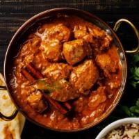 Chicken Tikka Masala · Boneless chicken breast cooked in clay oven and simmered in fenugreek flavored plum tomato s...