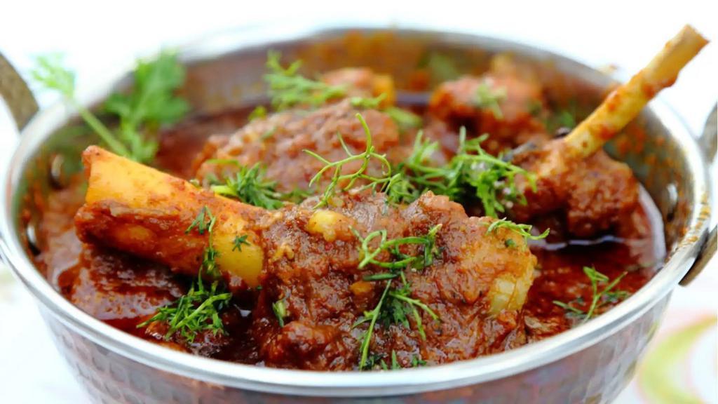 Goat Vindaloo · Goat and potatoes sautéed in spicy tangy sauce.