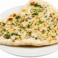 Garlic Naan · Soft leavened white bread with garlic and cilantro cooked in clay oven.